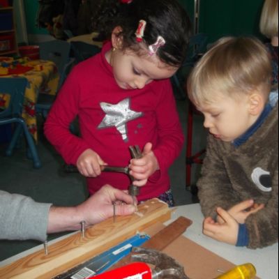 Nursery having a carpentry lesson